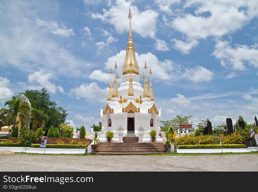 Golden Pagoda and blue sky in Wat Tham Khuha Sawan,Ubonratchathanee Province, Thailand.