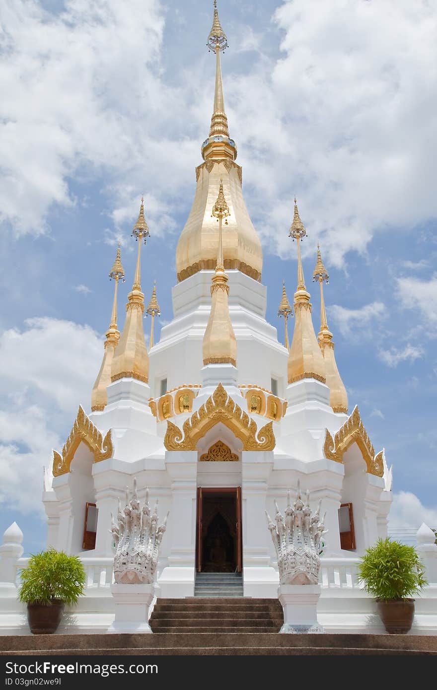 Golden Pagoda and blue sky in Wat Tham Khuha Sawan,Ubonratchathanee Province, Thailand.