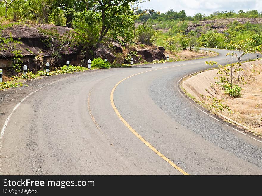 Road beside Mountain and blue sky in Countryside,Pha Taem National Park,North East of Thailand