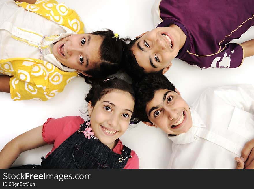 Horizontal  photo of four children group,  smiling