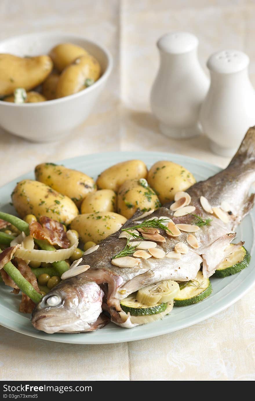 Oven-baked trout stuffed with fennel and courgettes