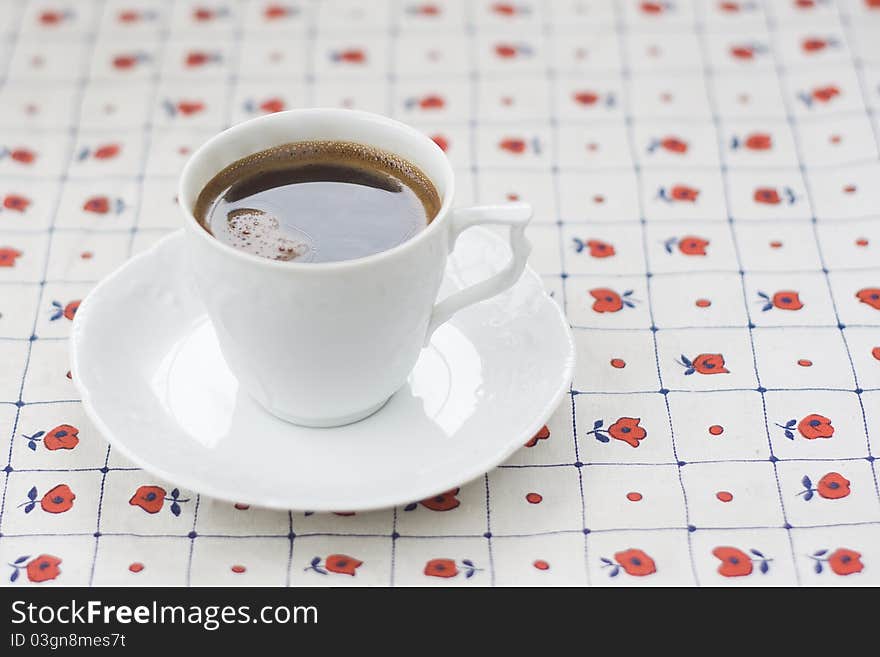 A cup of coffee and a saucer