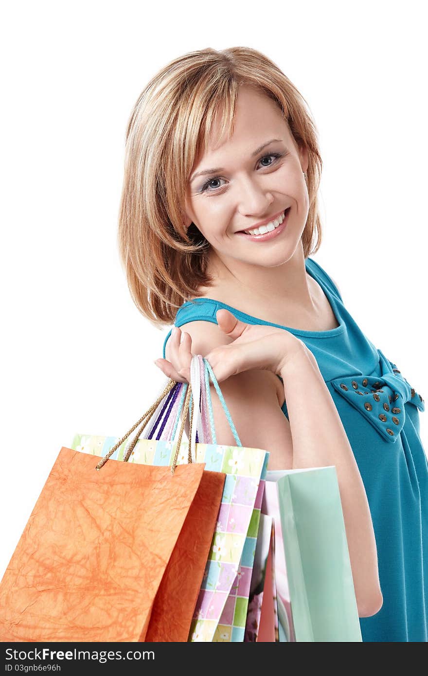 Smiling girl with the packages on a white background. Smiling girl with the packages on a white background