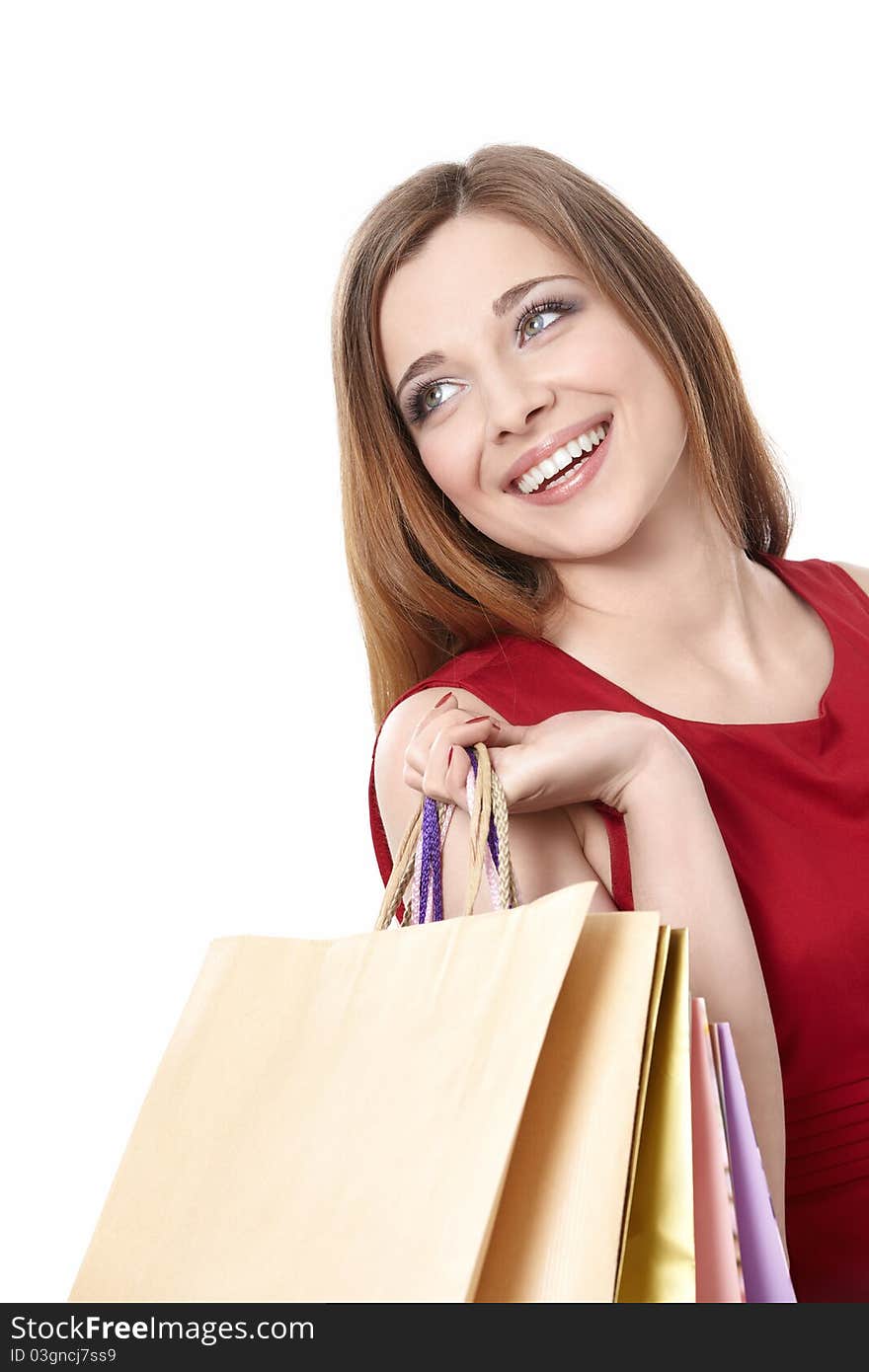 Attractive girl with a package on a white background