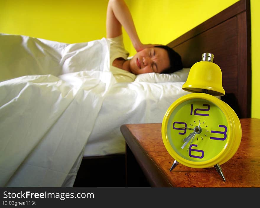 Woman and alarm clock in bedroom. Woman and alarm clock in bedroom