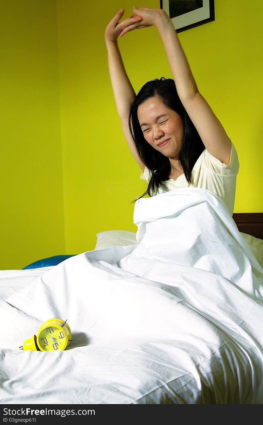 Woman and alarm clock in bedroom. Woman and alarm clock in bedroom