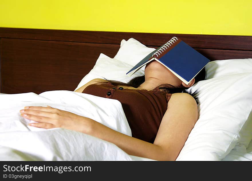 Woman with a book in bedroom. Woman with a book in bedroom