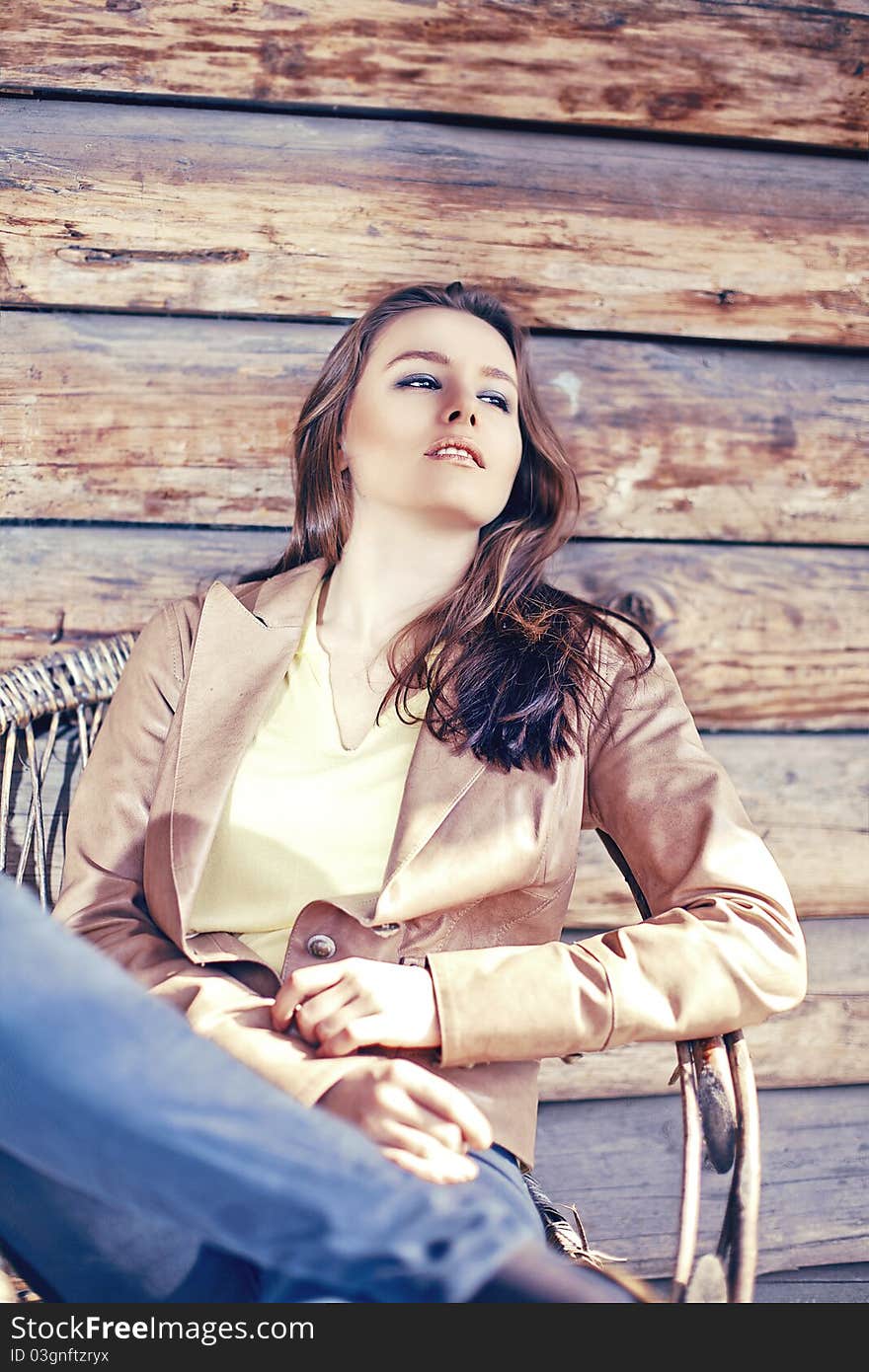 Young Beautiful Brunette Woman Sit In Arm Chair