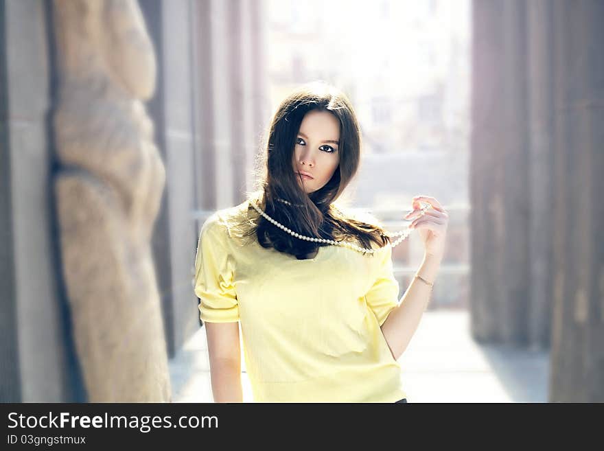 Portrait of  brunette woman with pearls