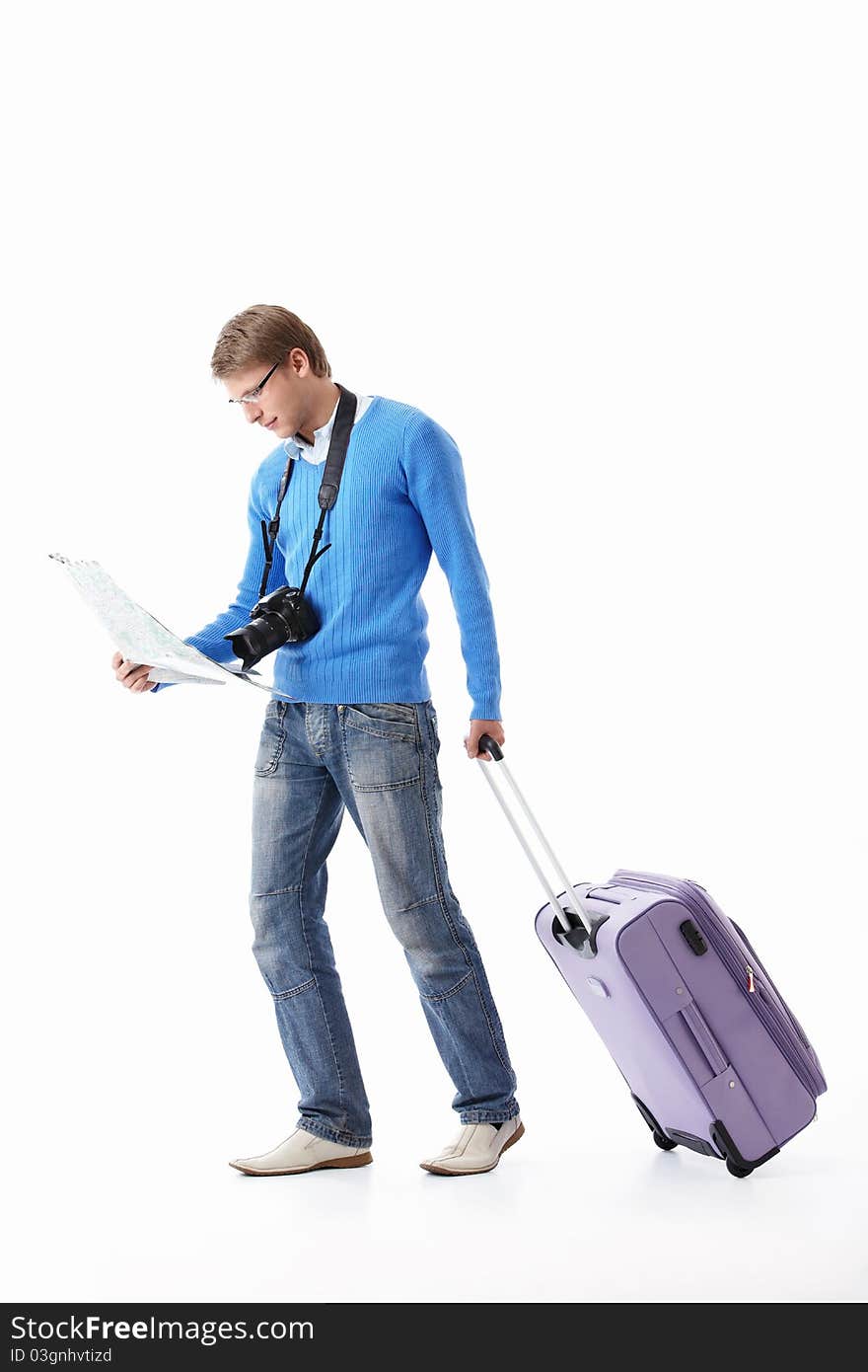 A young man with a suitcase on a white background. A young man with a suitcase on a white background