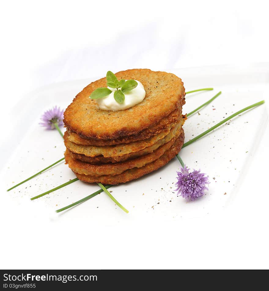 Fresh potato pancakes on white background