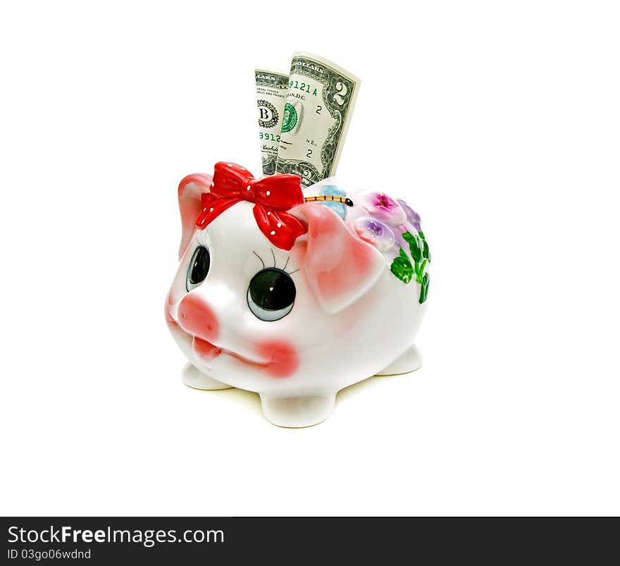 Piggy bank and $ 2 bill on white background