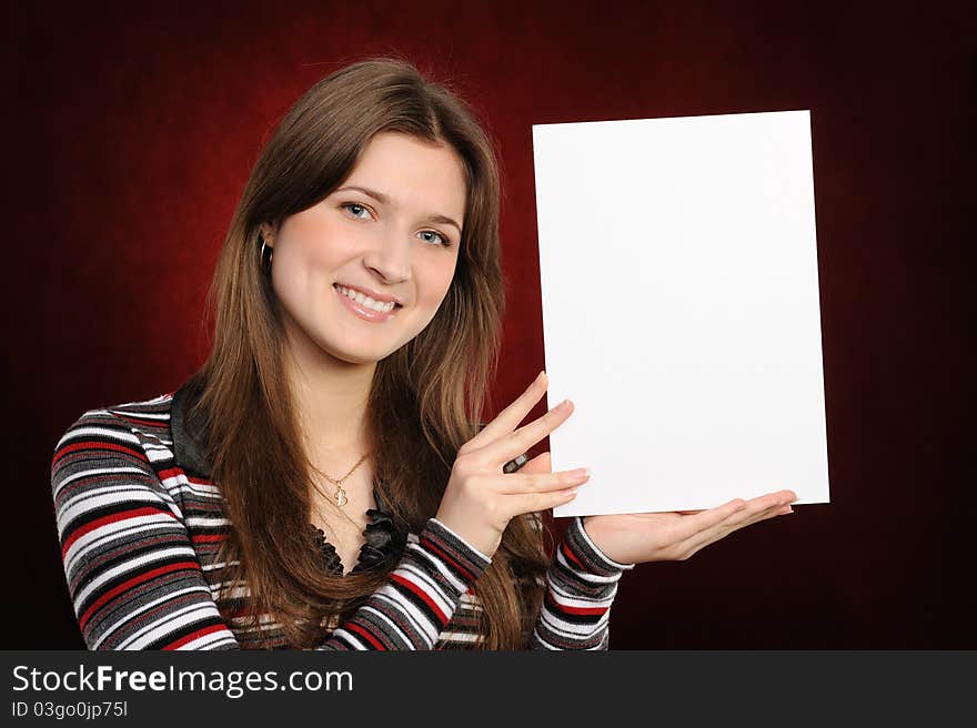 Young woman holding empty white board