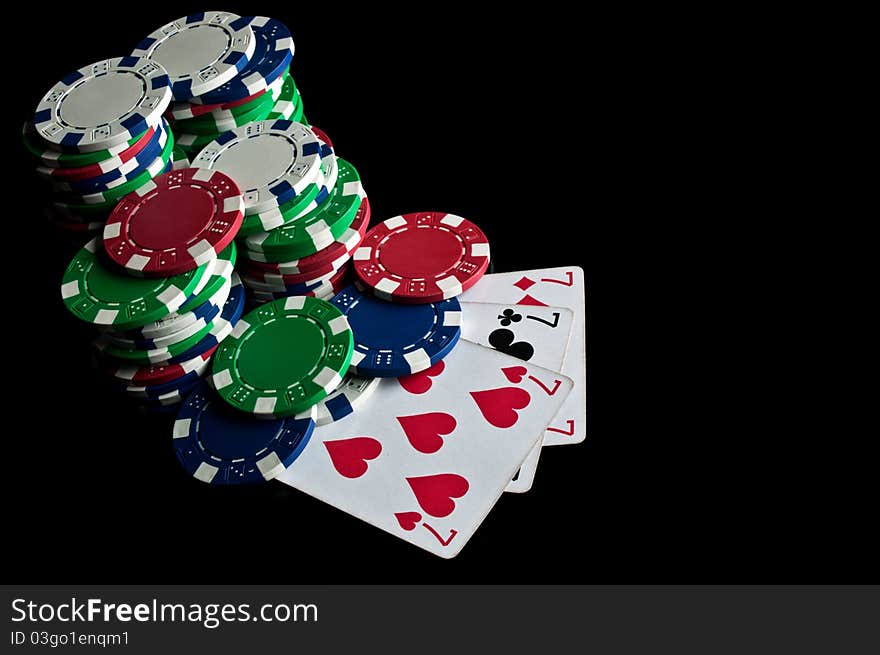 Success in poker and chips isolated on a black background