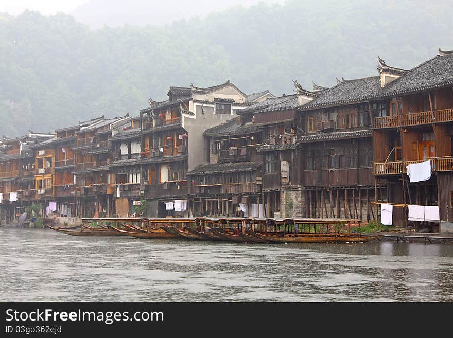 Boats and wooden houses at Fenghuang