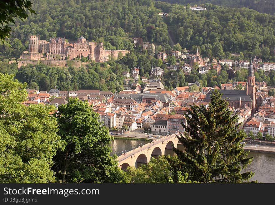 The scenery of Heilderberg dominated by the Heilderberg castle and Old Bridge seen from the viewpoint over the city, Germany. The scenery of Heilderberg dominated by the Heilderberg castle and Old Bridge seen from the viewpoint over the city, Germany.