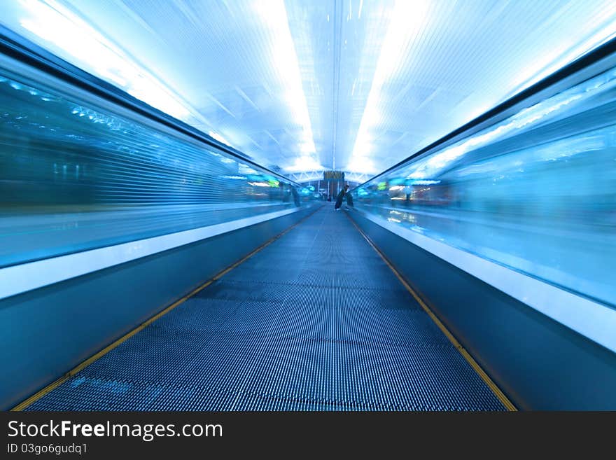 Moving escalator in airport