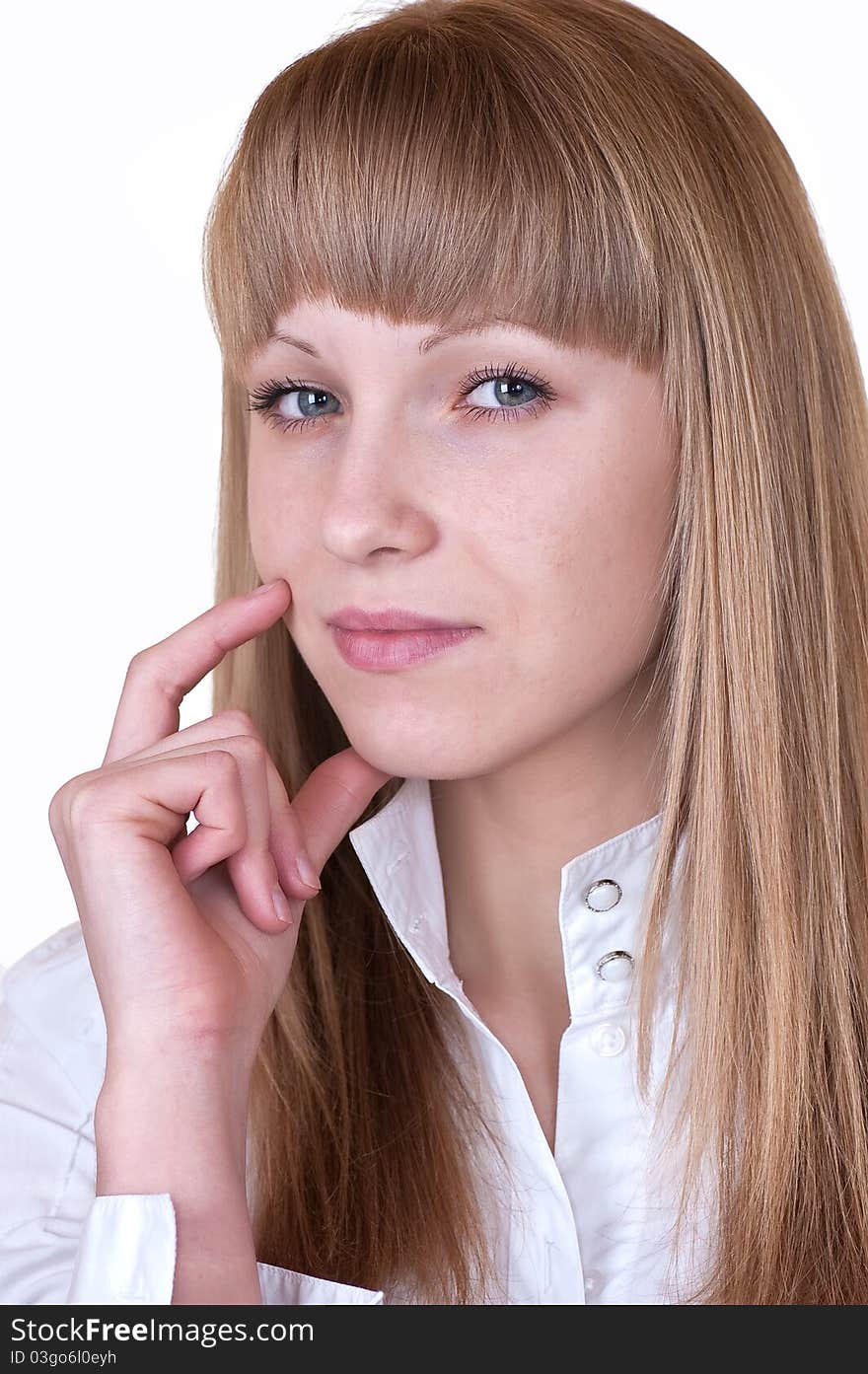 The lovely girl in a white blouse with a severe look