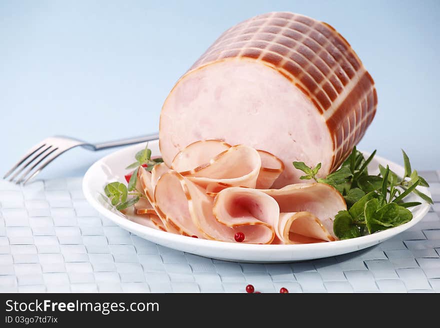 Tasty sliced ham with herbs