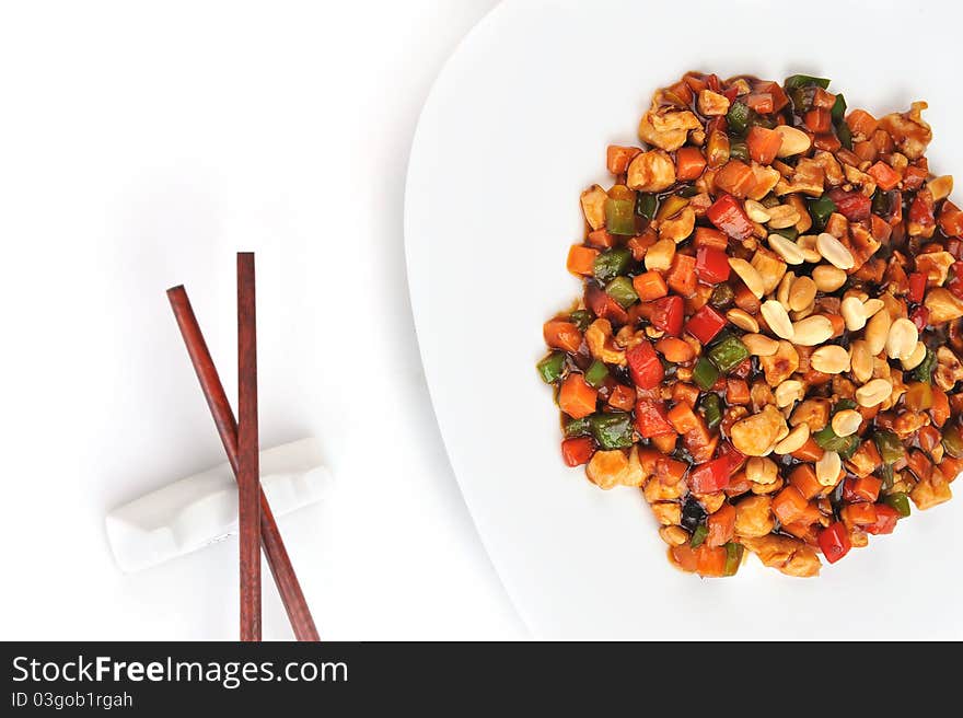 Steamed vegetables and meat with peanut on plate. Chinese cuisine.