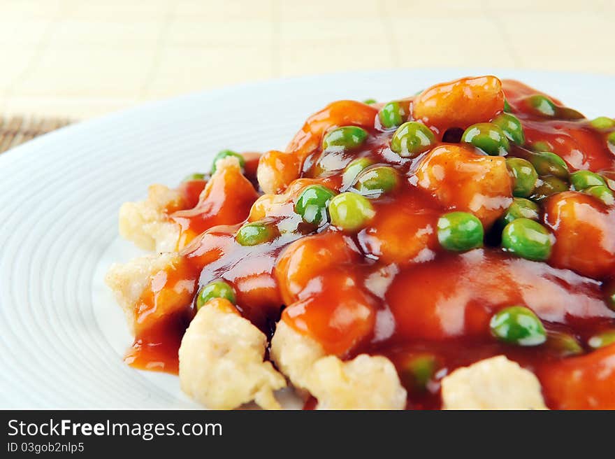 Deep fried chicken with red sauce. chinese cuisine