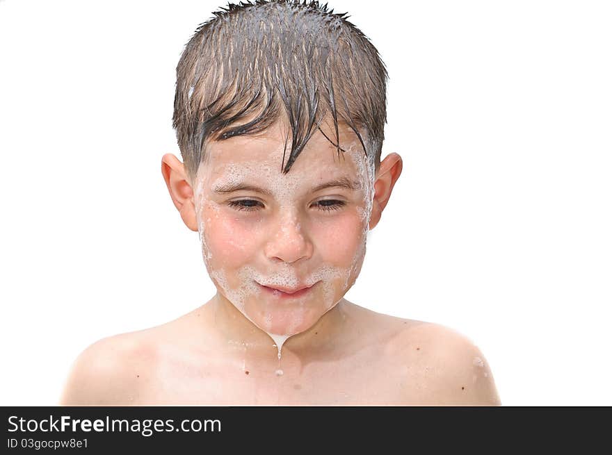 A boy swims in the bathtub. Isolated on white background picture