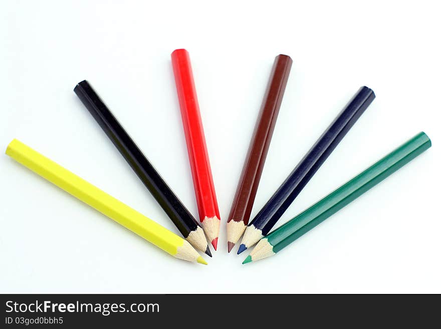 Kids color pencils on a white background