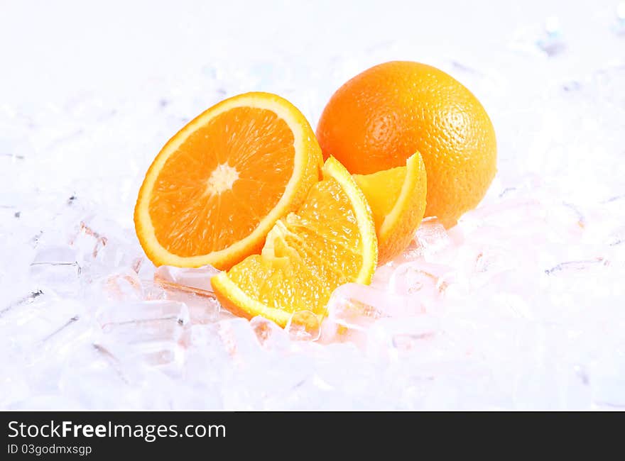 Fresh oranges in ice, close up view. Fresh oranges in ice, close up view