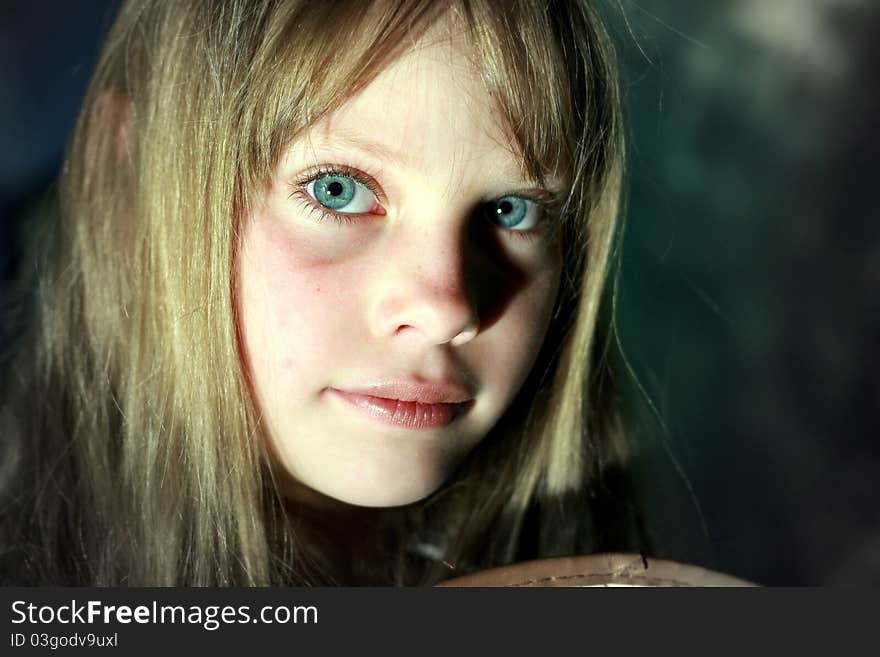 Close-up portrait beauty sad young girl looking at the camera