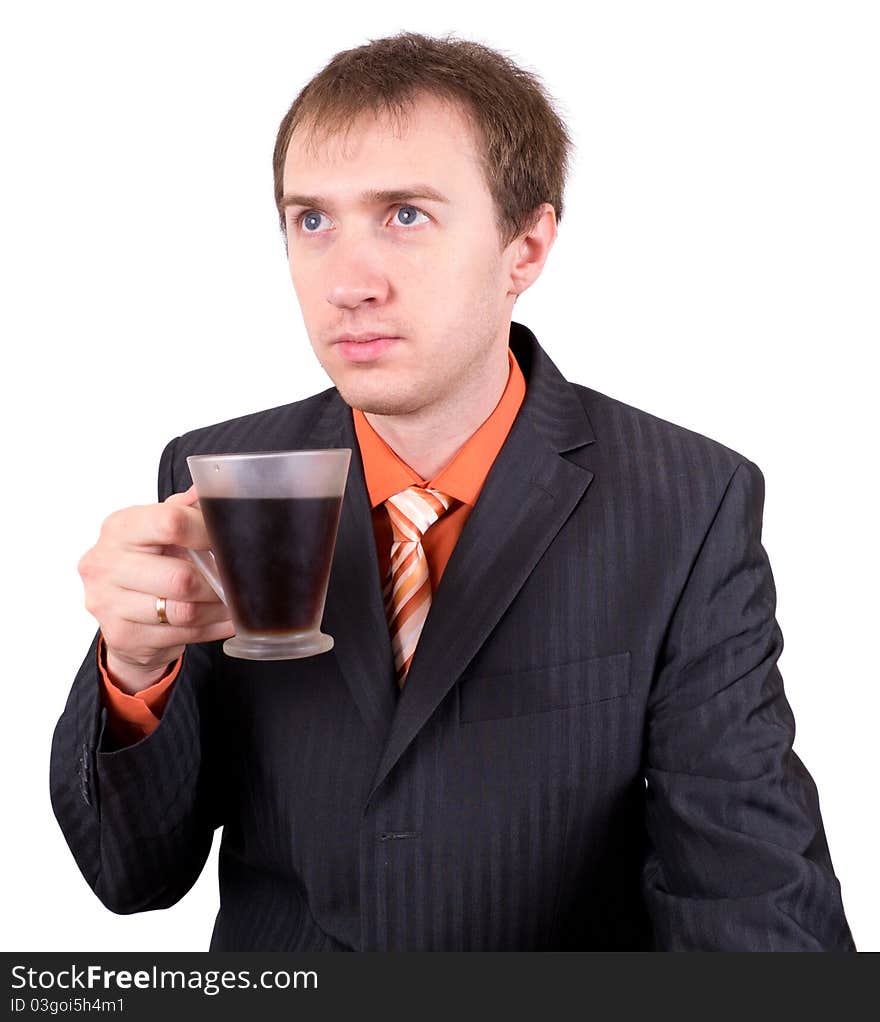 The young businessman drinks coffee. Morning.