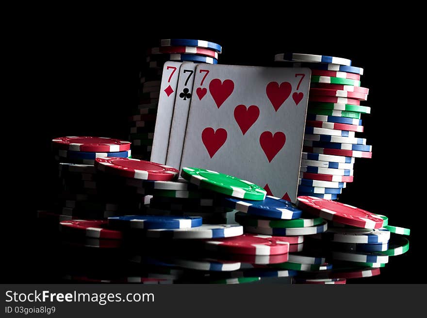 Success in poker and chips isolated on a black background