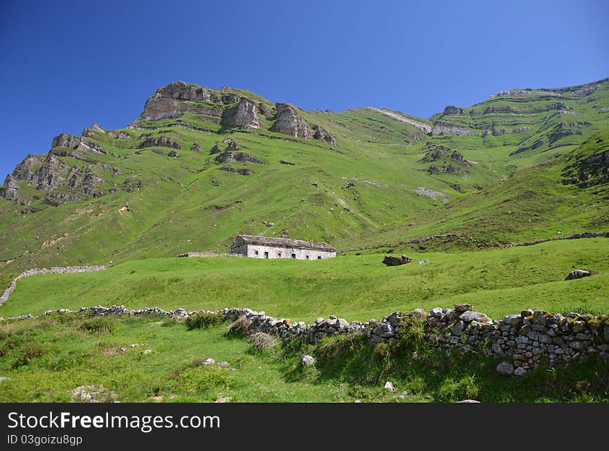 Panoramic view of the mountains of Lunada in Cantabria, with typical cabins and parcels. Panoramic view of the mountains of Lunada in Cantabria, with typical cabins and parcels