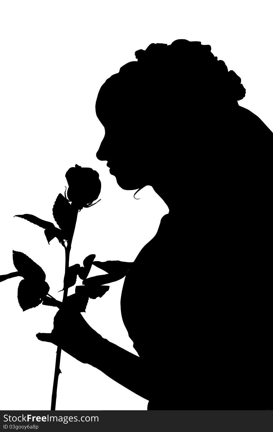 Silhouette of woman in wedding dress with rose