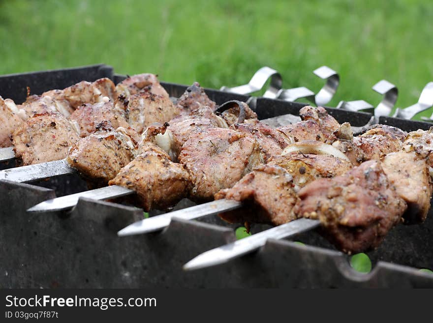 Juicy pork shashlick is prepared on Barbecue