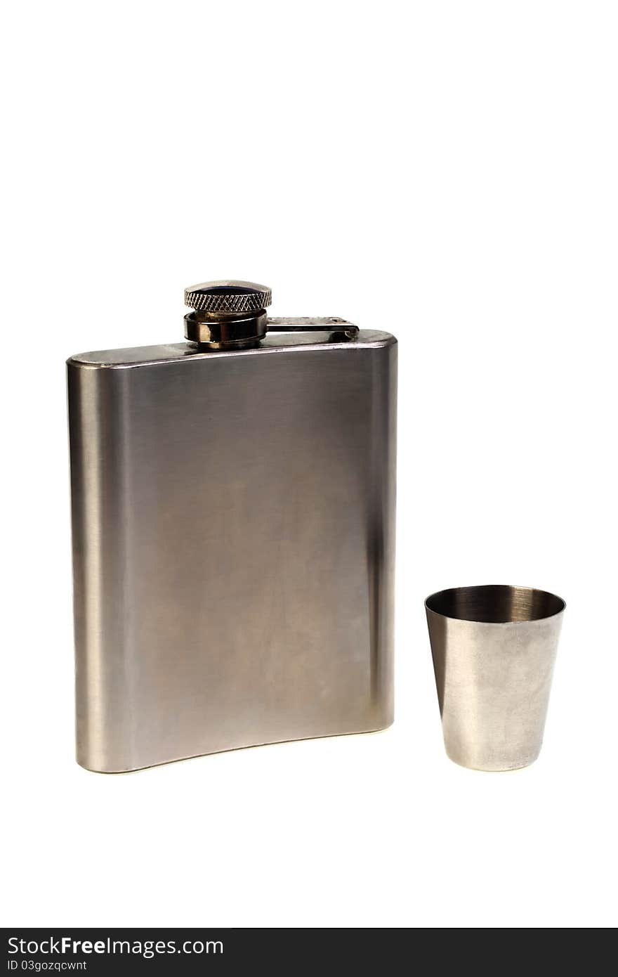 Metal flask and wine-glass on a white background