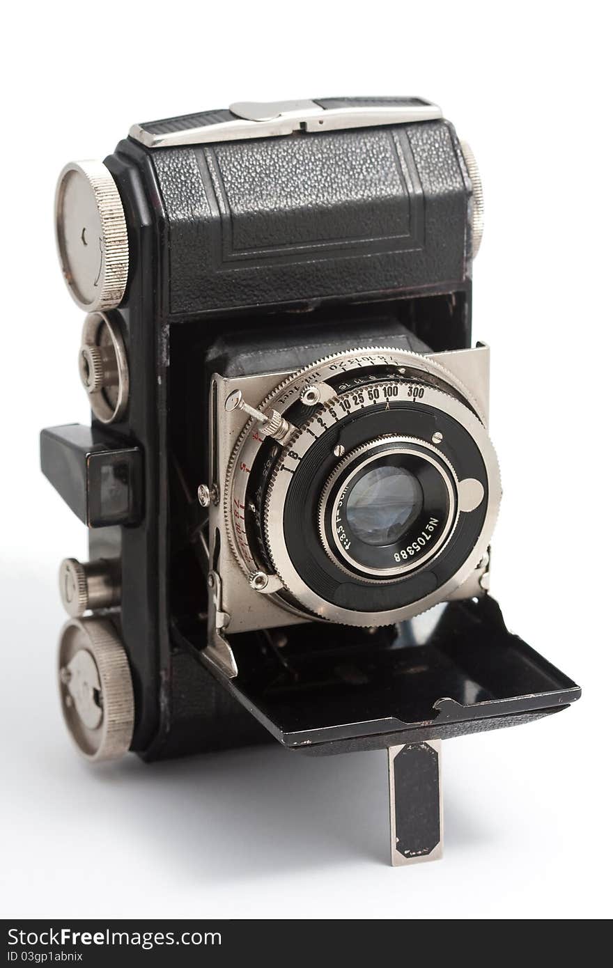 A vintage folding camera of German make.