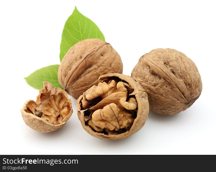 Walnuts with leafs on a white background