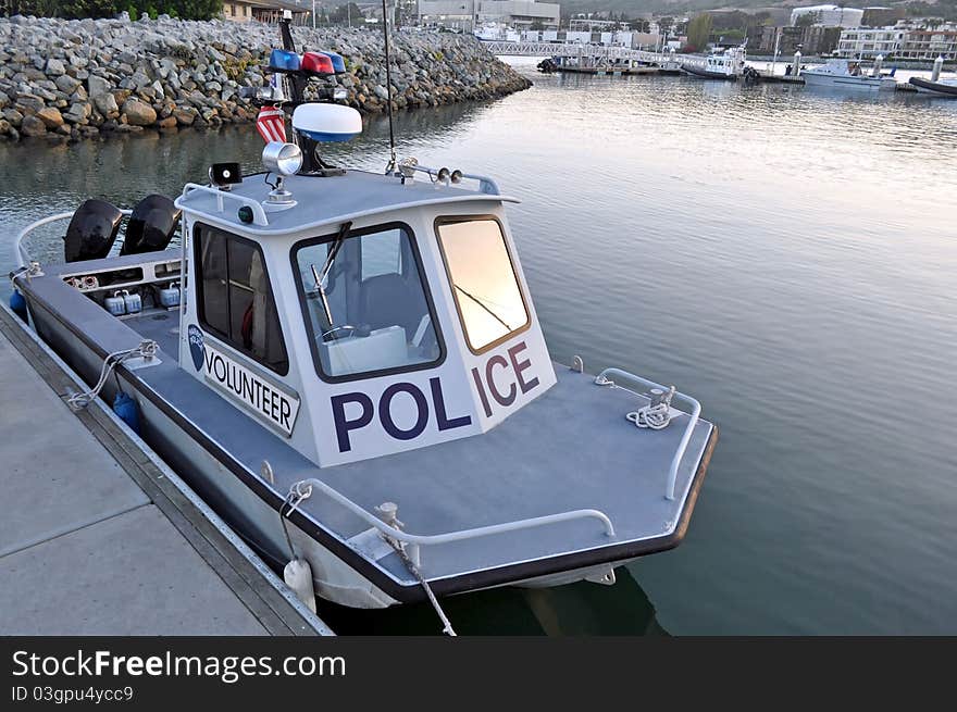 A Volunteer Harbor Police Boat docked in a Marina.