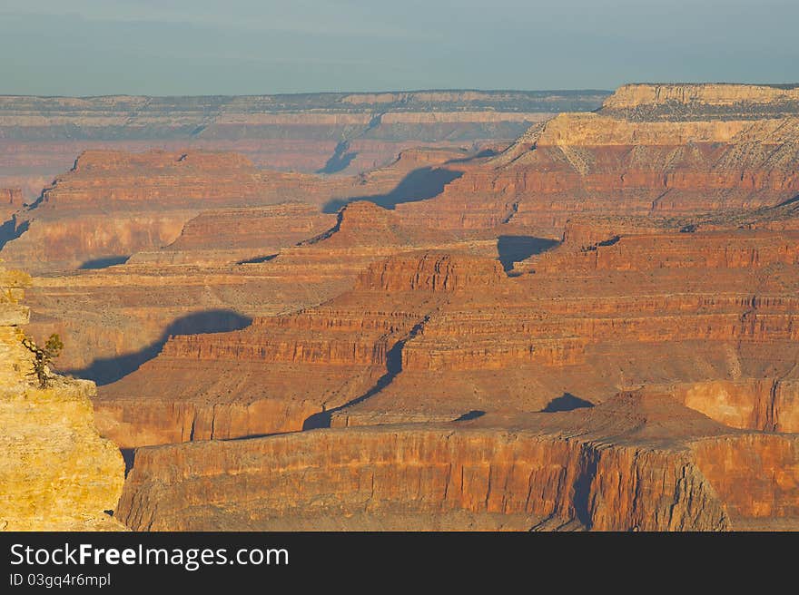 Grand canyon at sunrise with shadow to show the depth and dimension of the layers of the canyon