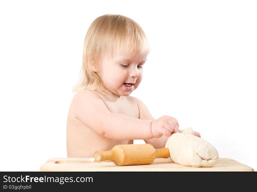 Adorable baby baking bread with rolling pin on white