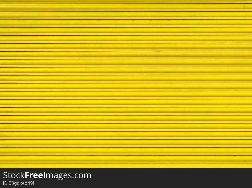 Bright yellow  metal shutter texture. Bright yellow  metal shutter texture