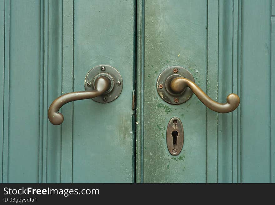 Closeup of vintage wooden green door