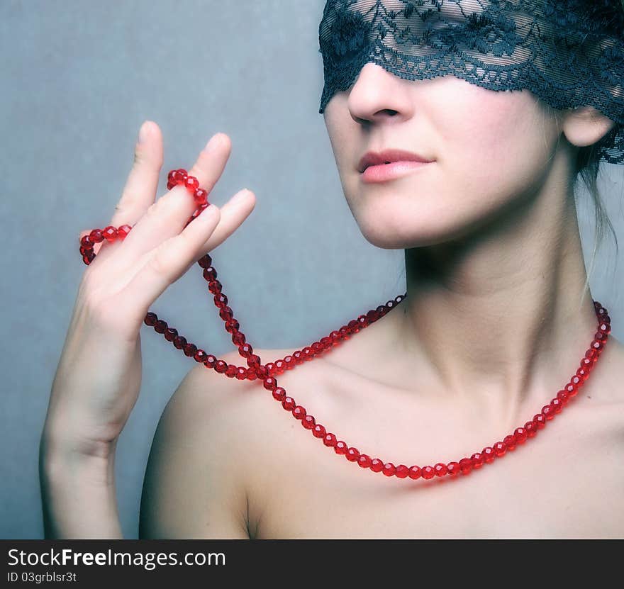 Beautyful woman with red necklace