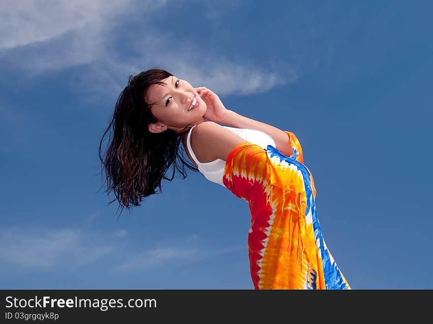 Girl relaxing on a sunny day with a beautiful blue sky in the background. Girl relaxing on a sunny day with a beautiful blue sky in the background