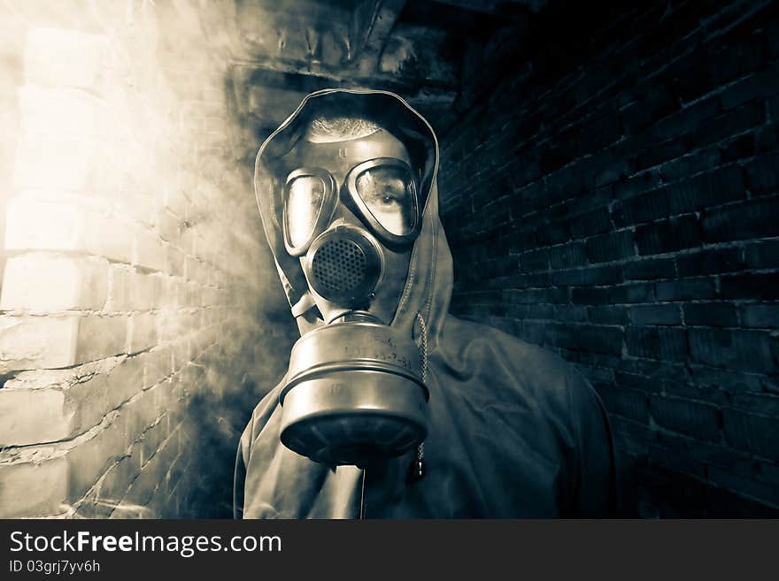 Bizarre portrait of man in gas mask