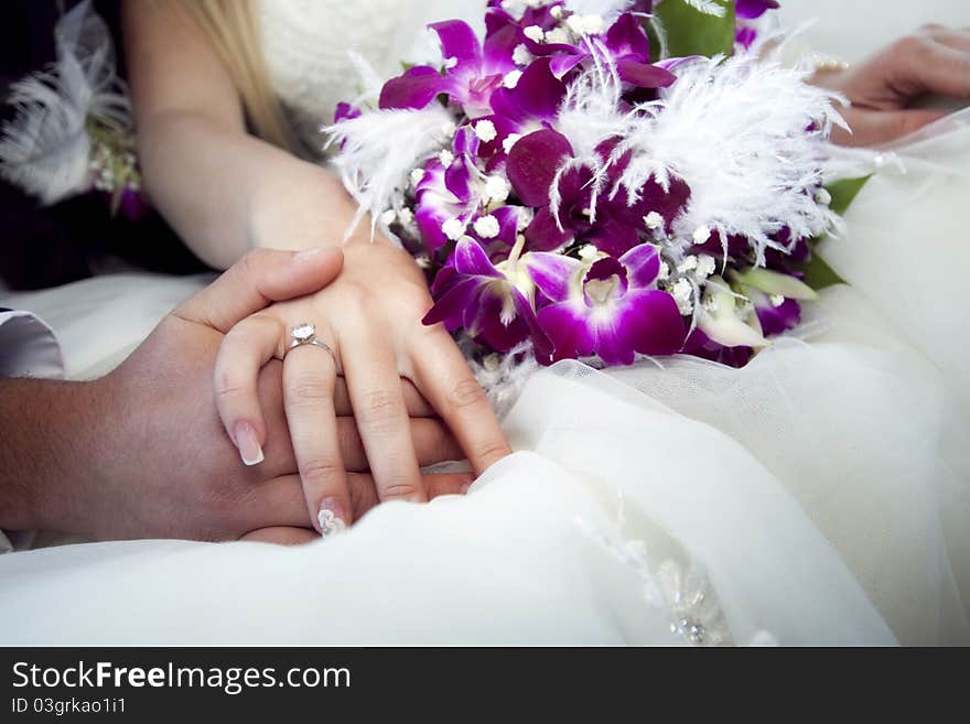 Hands And Rings On Bouquet