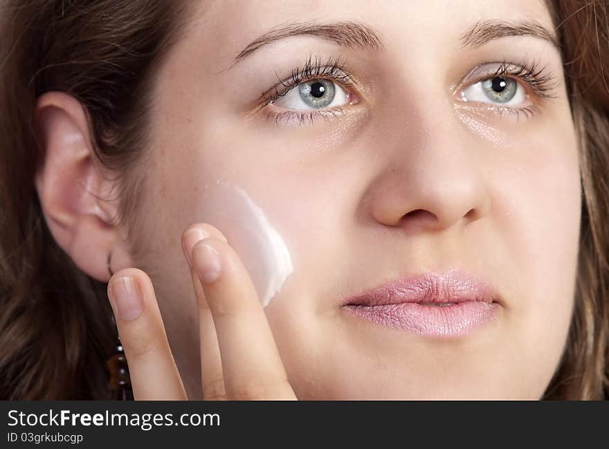 Caucasian Young Woman Applying Moisture