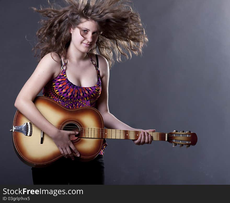 Young girl playing guitar