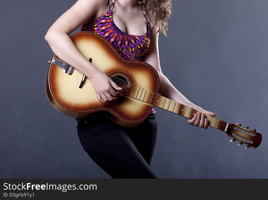 Young girl playing guitar