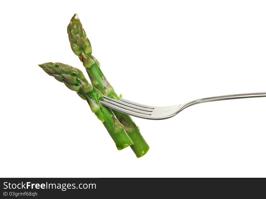 Asparagus spears on a fork